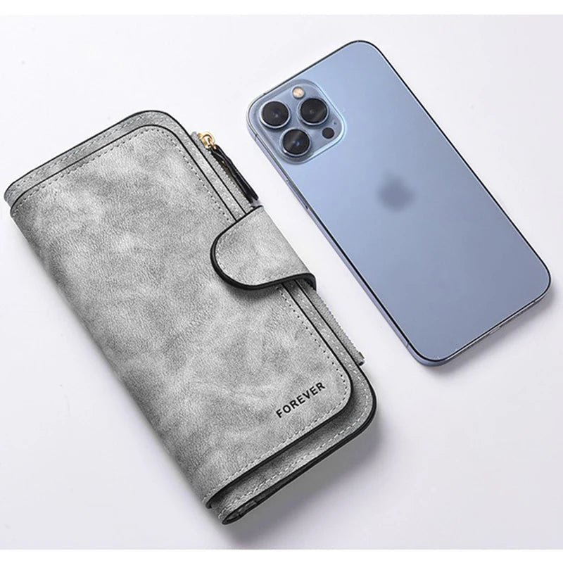 Portfel damski z długim zamkiem błyskawicznym i klamrą, skóra