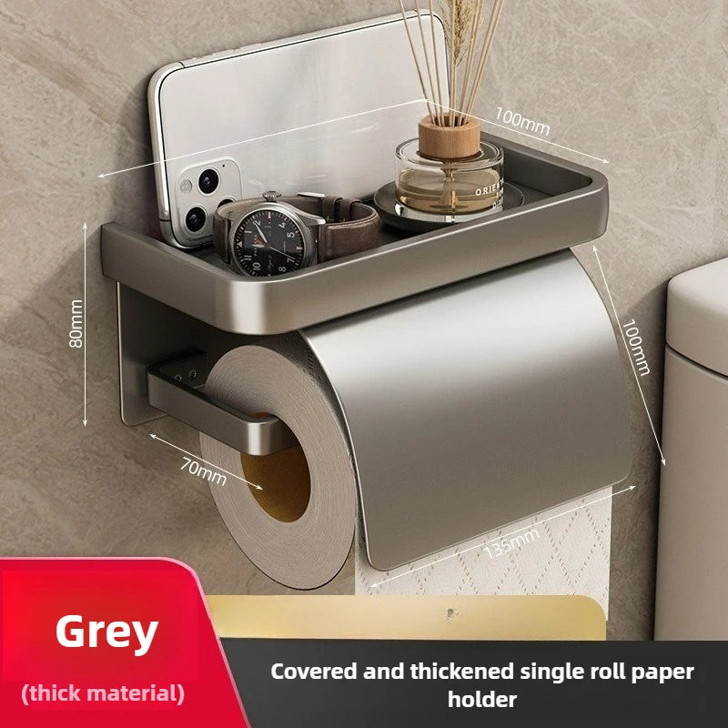 Držiak toaletného papiera do kúpeľne, namontovaný na stenu.